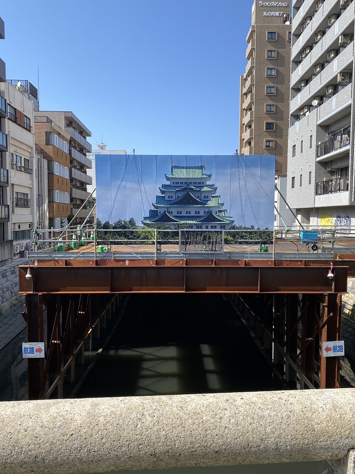 A photo of a castle strung up on a random bridge in Nagoya, Japan