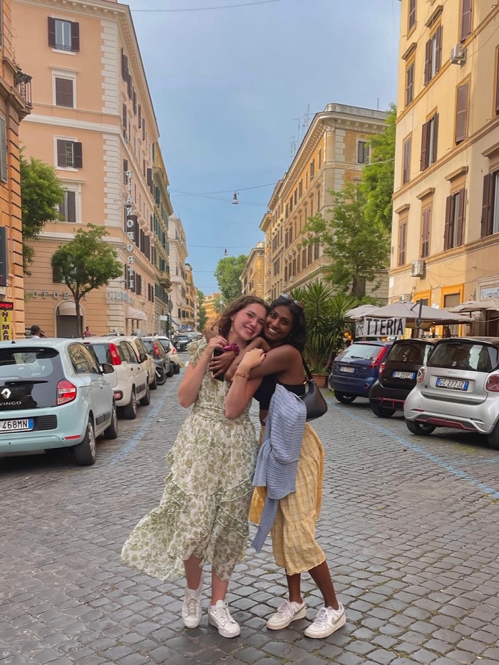 Two CET Siena students hugging one another in the middle of the street in Rome, Italy