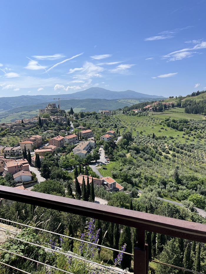 Views of of Val d’Orcia, neighboring cities. and trees from the top of the Tower of Tintinnano in Italy
