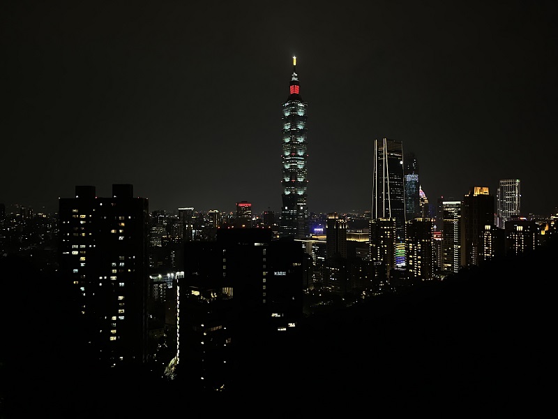 Skyline of the Xinyi District lit up at night atop Elephant Mountain