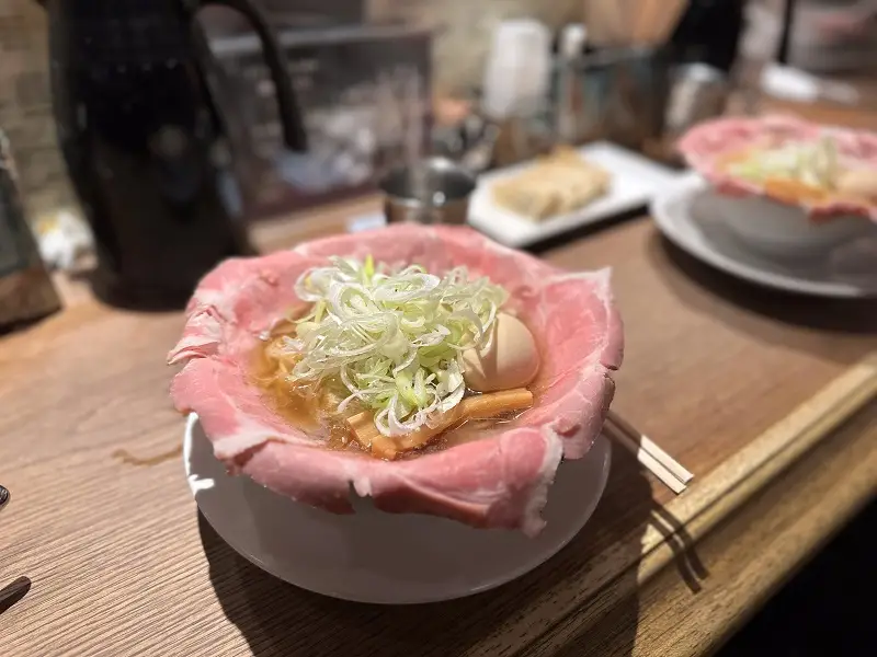 Ramen with thinly sliced meat, eggs, and vegetables from a popular store in Umeda