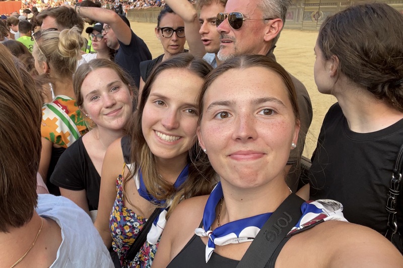 CET Siena students waiting within a crowd outdoors for the 2023 Palio di Siena