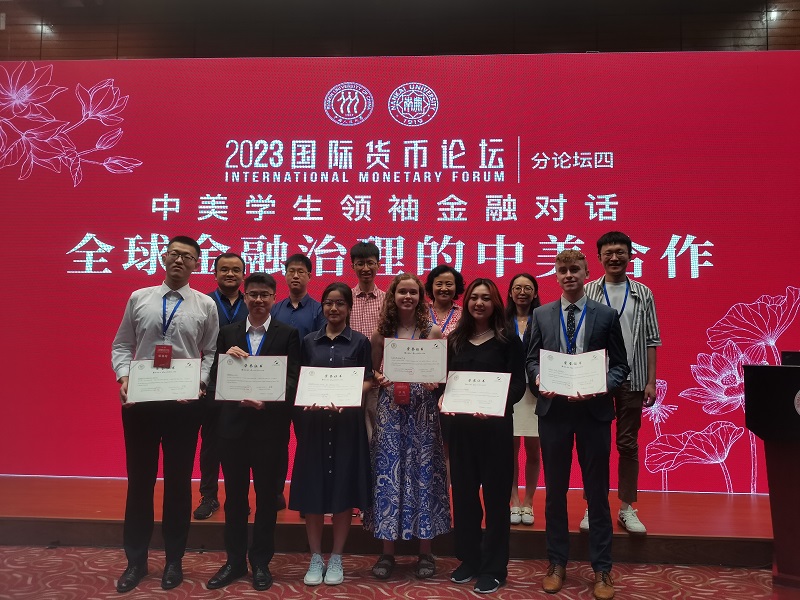 American and Chinese students holding up certificates with university professors at Renmin University’s International Monetary Forum