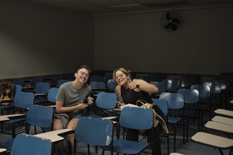 Two CET Brazil Social Justice students sitting in a classroom together