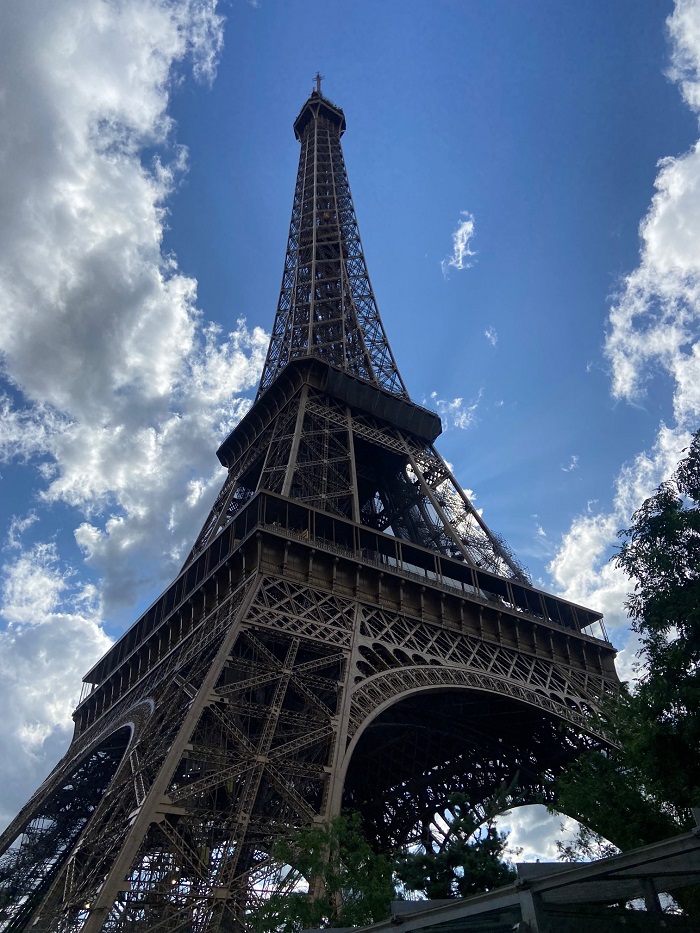 Eiffel Tower in Paris, France on a partly cloudy day