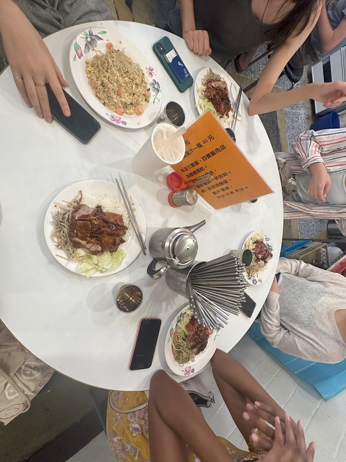 A table with duck, friend rice, and other dishes in a restaurant in Taiwan