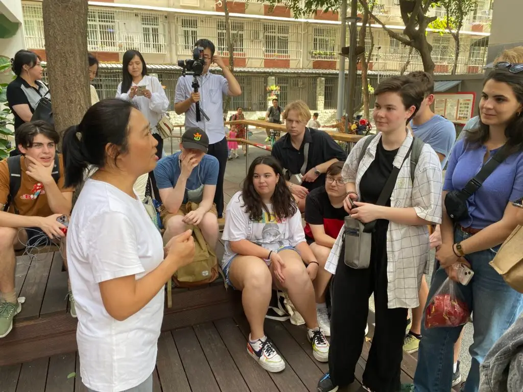 Group looking and listening to a woman