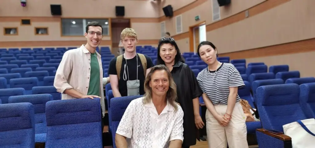 Smiling group photo in auditorium