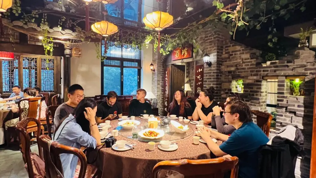 Friends sitting around dinner table