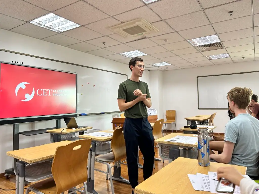 Man in classroom talking to students