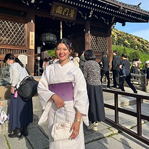 woman smiling wearing traditional Japanese garment