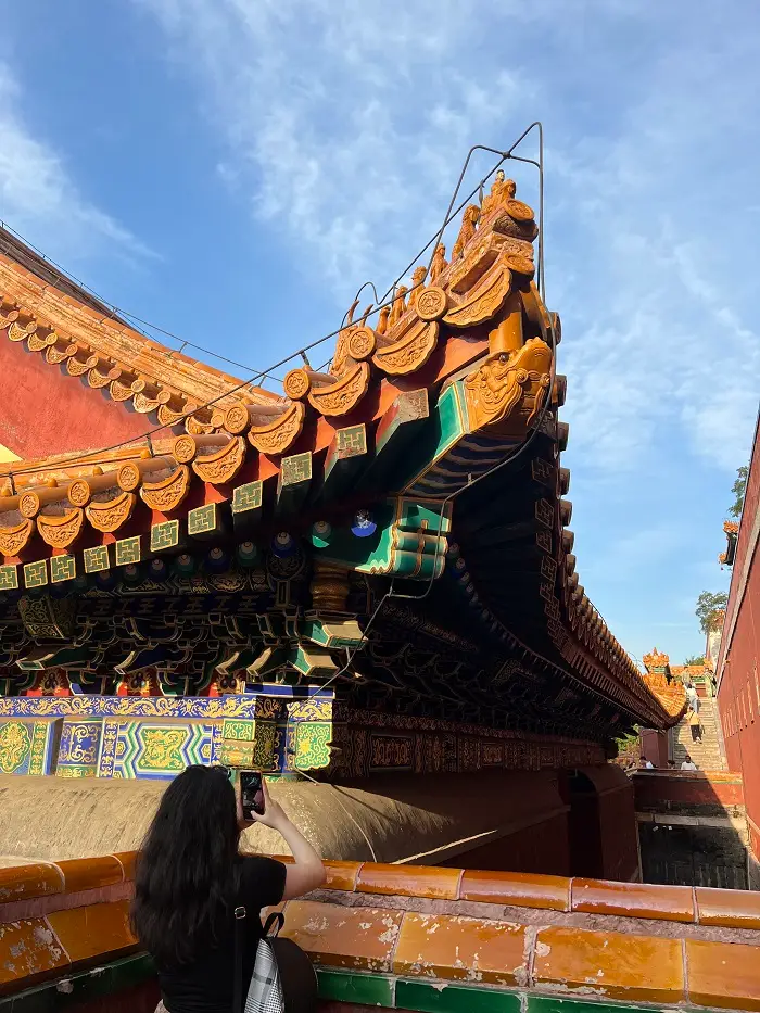 CET Beijing student taking a picture of the architecture at the Summer Palace