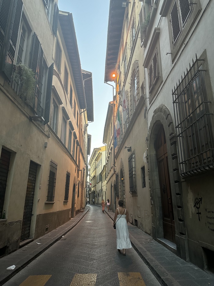A narrow street with buildings on both sides in Florence, Italy