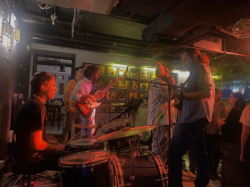 A band group playing different instruments at a bar downtown in Amman, Jordan