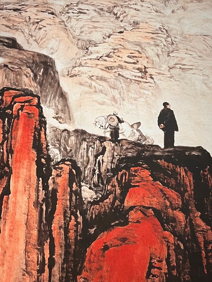 A painting of men atop a mountain, looking out into the great expanse of the world in the National Museum in Beijing, China