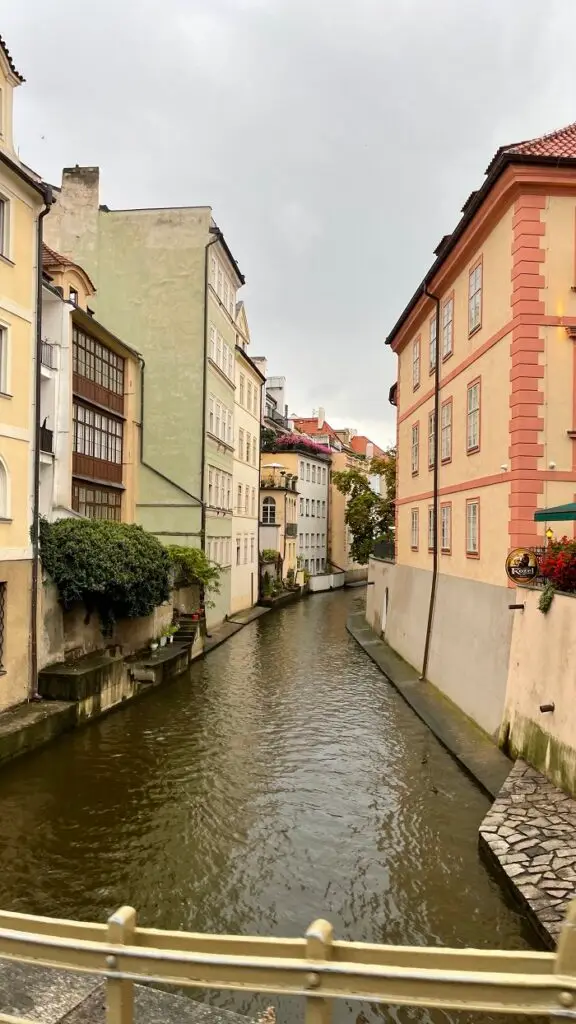 A canal in Prague named Čertovka with buildings on each side of the canal