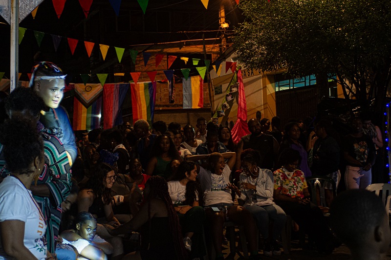 People in a street at dark in Aguablanca, Colombia celebrating 