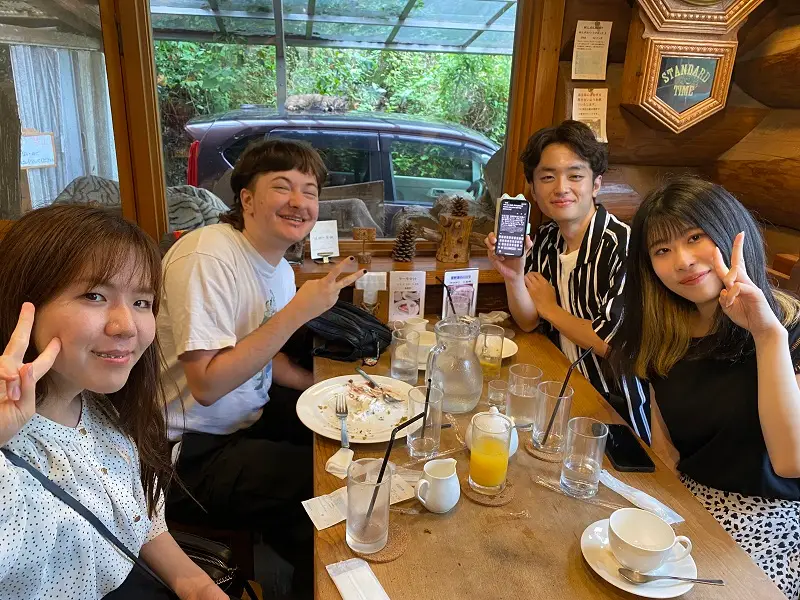 CET Japan and Osaka Gakuin University roommates sitting around a table in Grandfather's Clock café in Japan