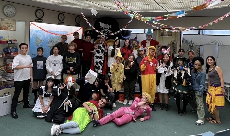 A large group of students at CET Japan and Osaka Gakuin University wearing Halloween costumes
