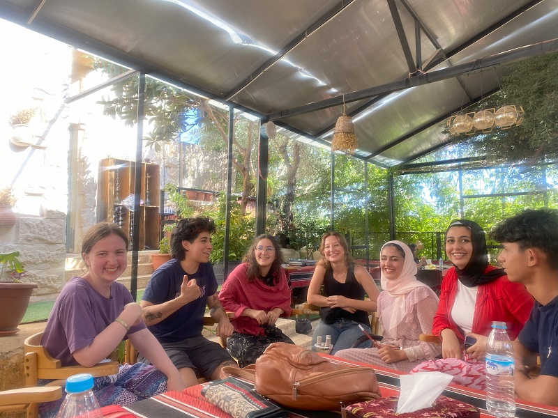 CET Jordan students in Jaresh with their Jordanian Neighbors enjoying a traditional lunch together