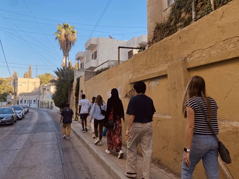 CET Jordan students walking downtown Amman on a graffiti tour led by Alaeddin Rahmeh