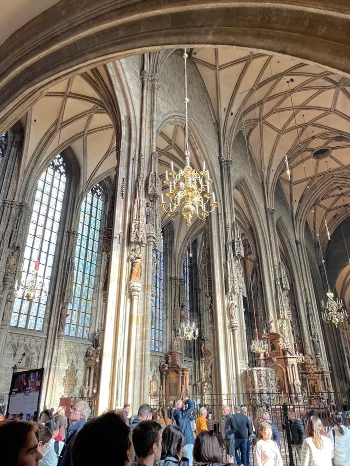 Many people inside the St. Stephen's Cathedral in Vienna, Austria