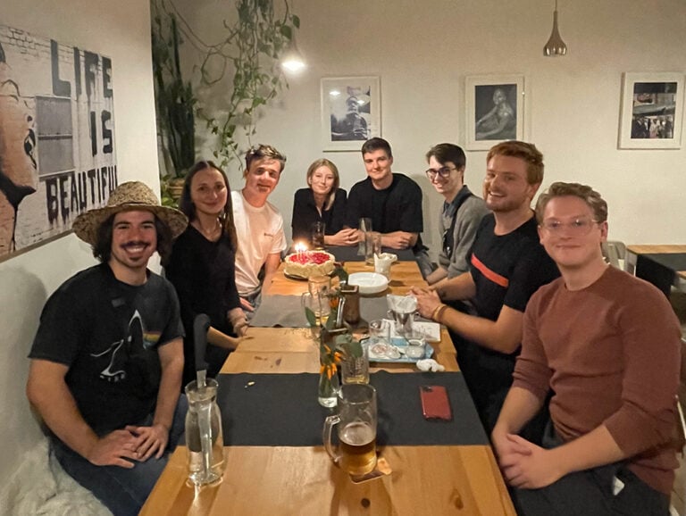 students having dinner with their Czech roommates