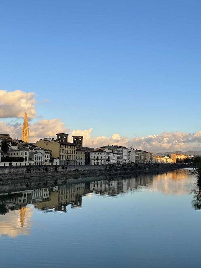 A view of buildings along the river from Ponte alle Grazie in Florence, Italy