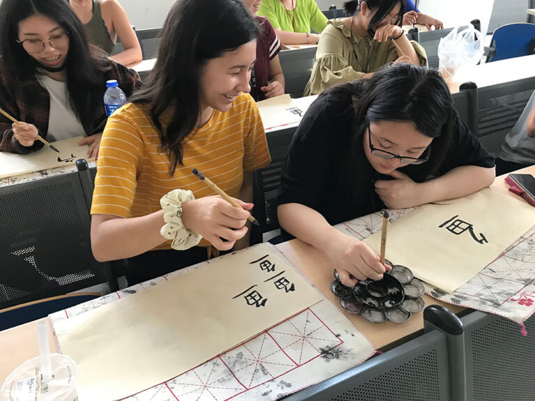 students practicing calligraphy