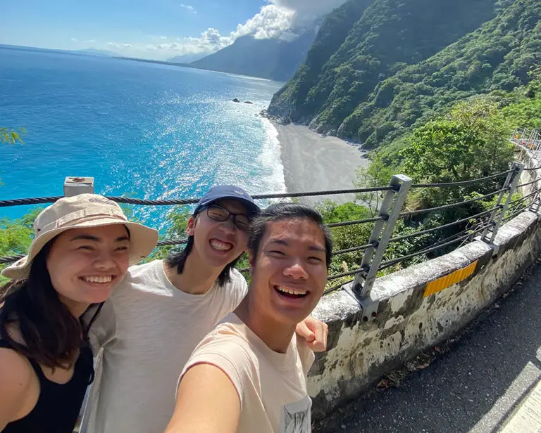 student selfie with water behind