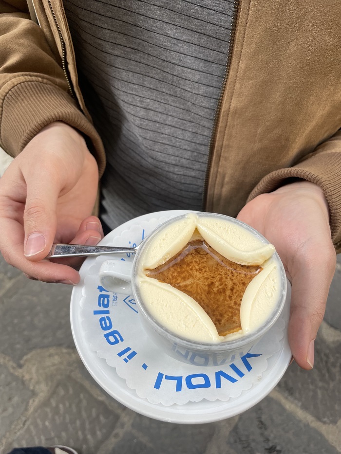 A hand holding an affogato drink from Vivoli in Florence, Italy