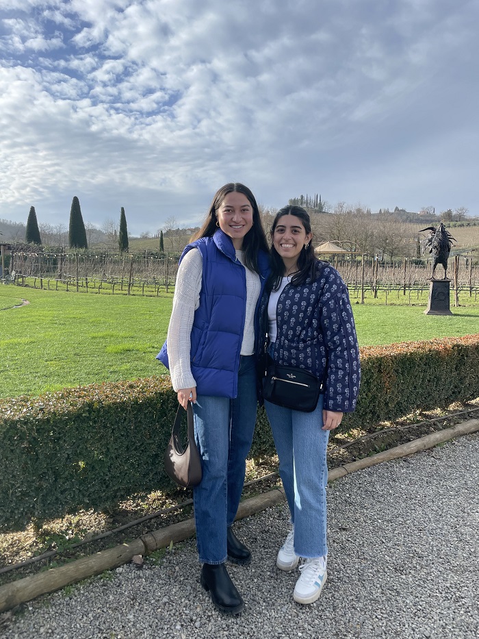 A CET Florence student and her roommate posing by a winery