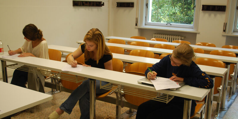students writing in classroom