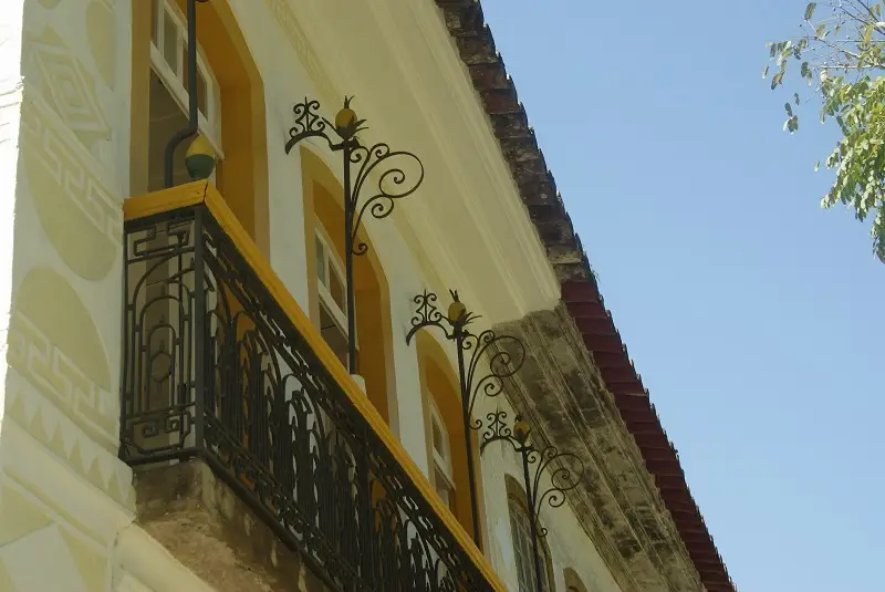 The side railing with pineapples and "33" of a building in Paraty, Brazil