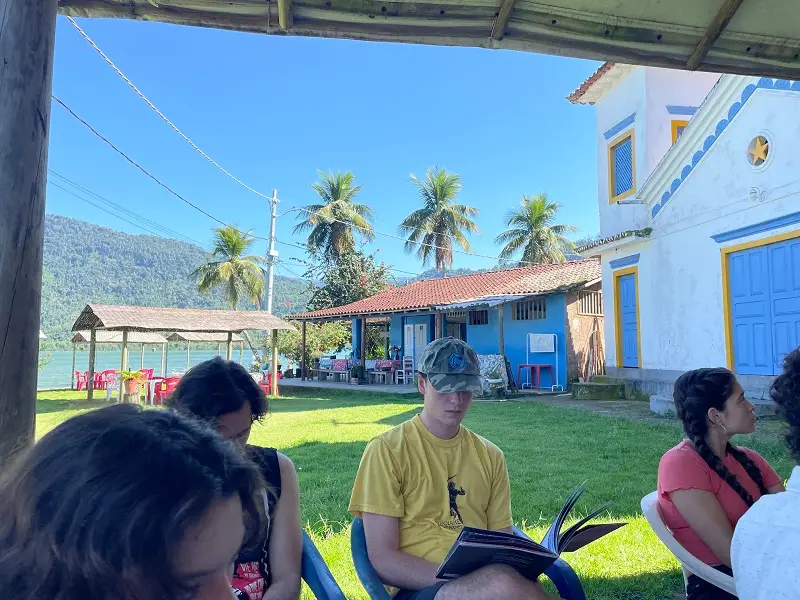 CET Brazil students sitting outside while learning in Paraty, Brazil