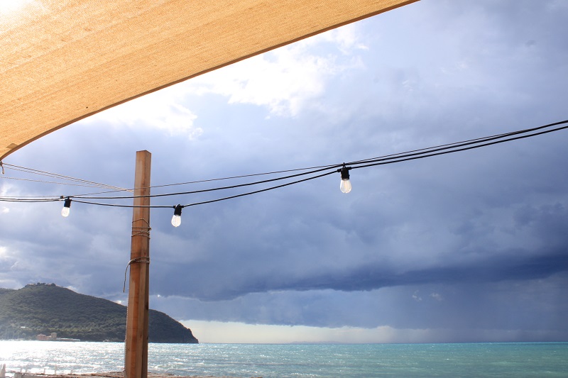 Cloudy skies at Populonia Beach