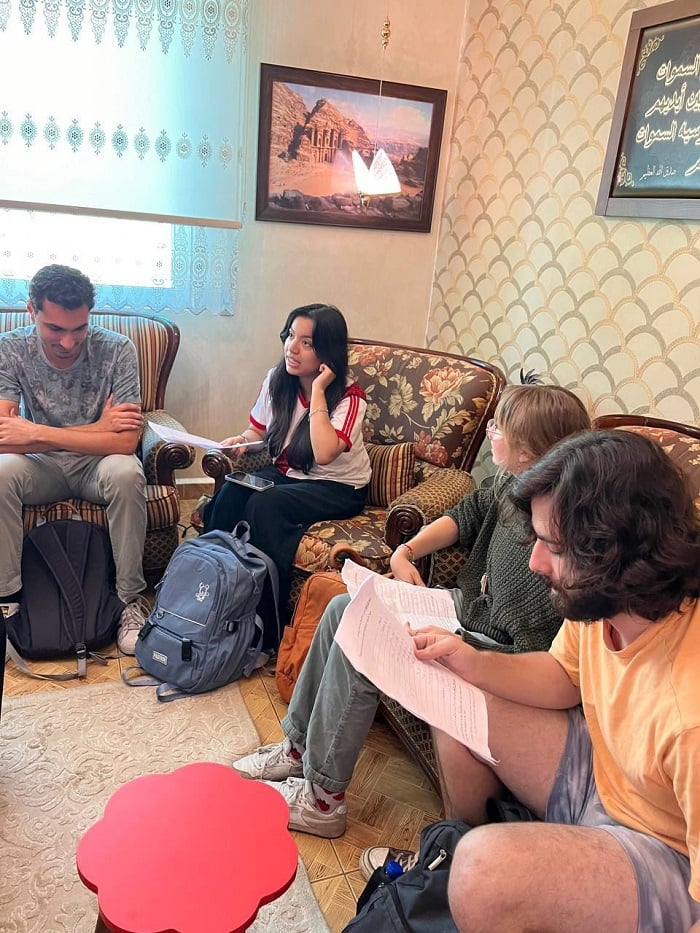 CET Jordan students sitting on couches while having conversations in Arabic 