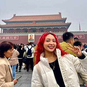 student in front of temple