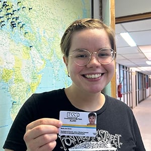 student holding ID