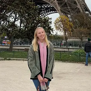 woman standing in front of Eiffel tower