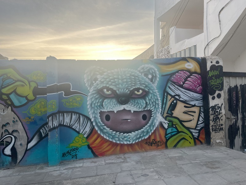 Graffiti of cartoon drawings on a wall in Amman, Jordan