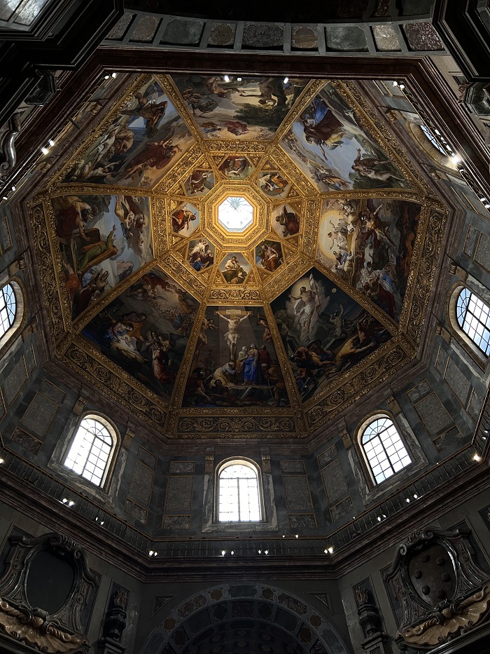 Details of the ceiling frescoes in gold and colorful painting within the Medici Chapel in Florence, Italy