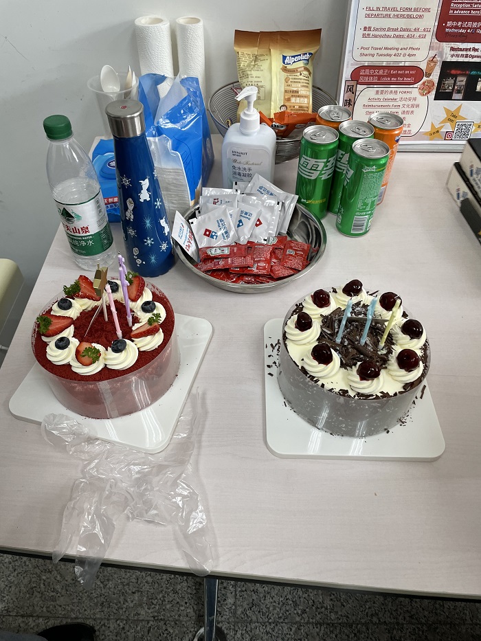 Two small cakes and drinks set up on a table