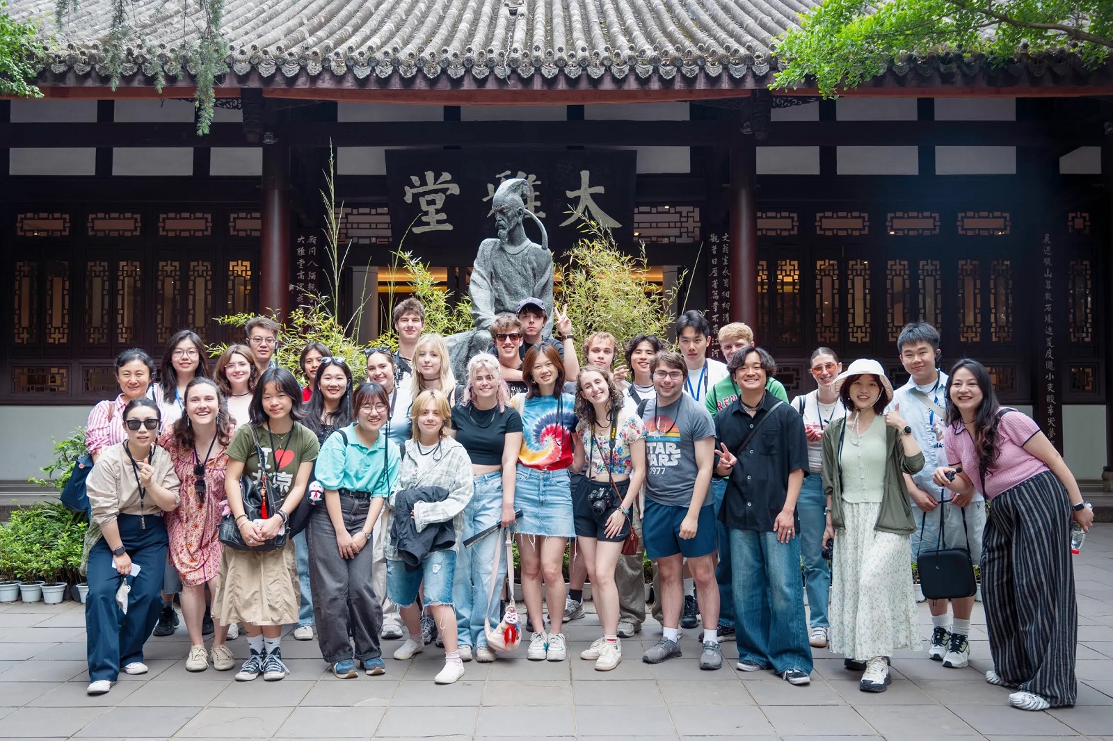 A large group of CET Beijing students posing in front of the home and museum of Du Fu