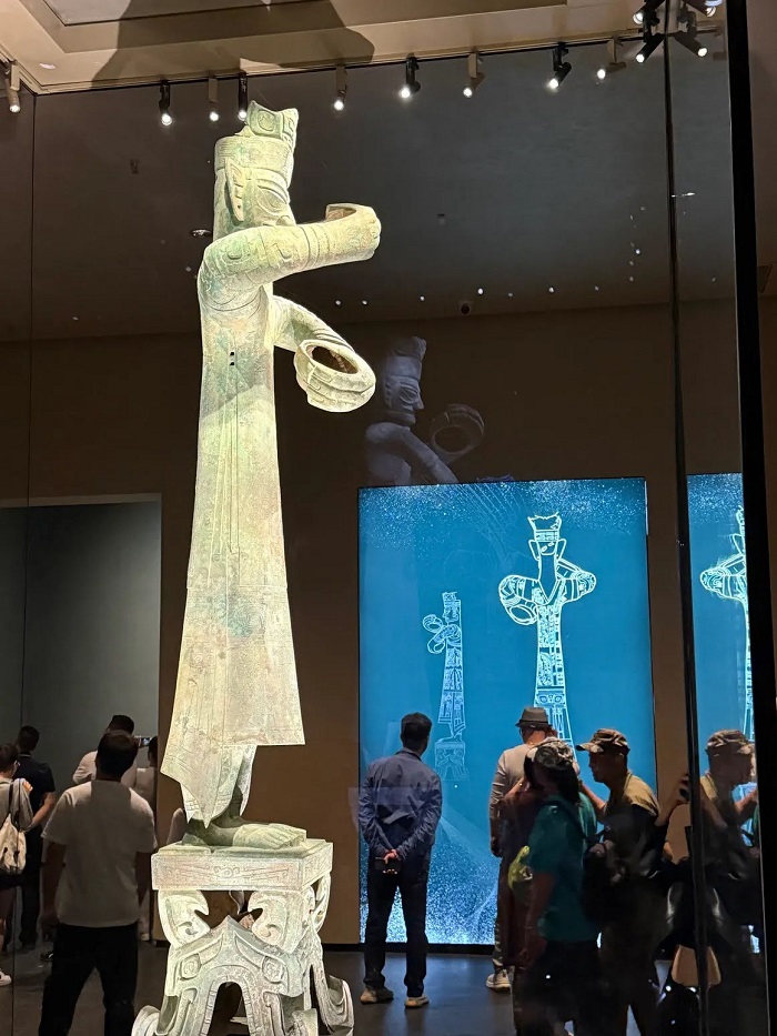 About a 9-foot bronze statue at the San Xing Dui museum