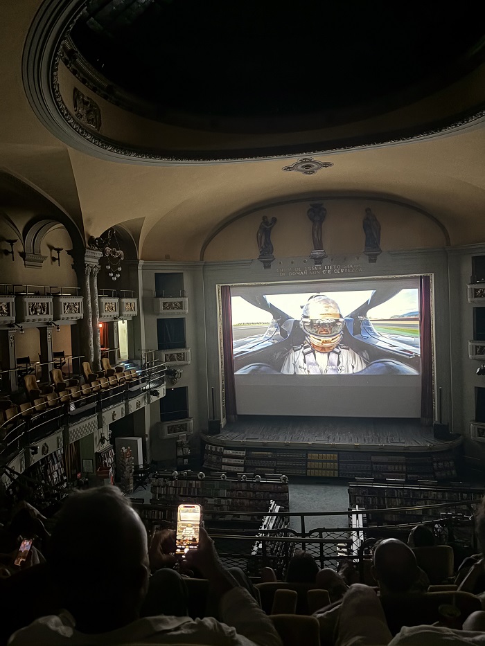 People watching the F1 movie at Giunti Odeon, a unique space that combines a historic bookstore with a cinema in Florence, Italy