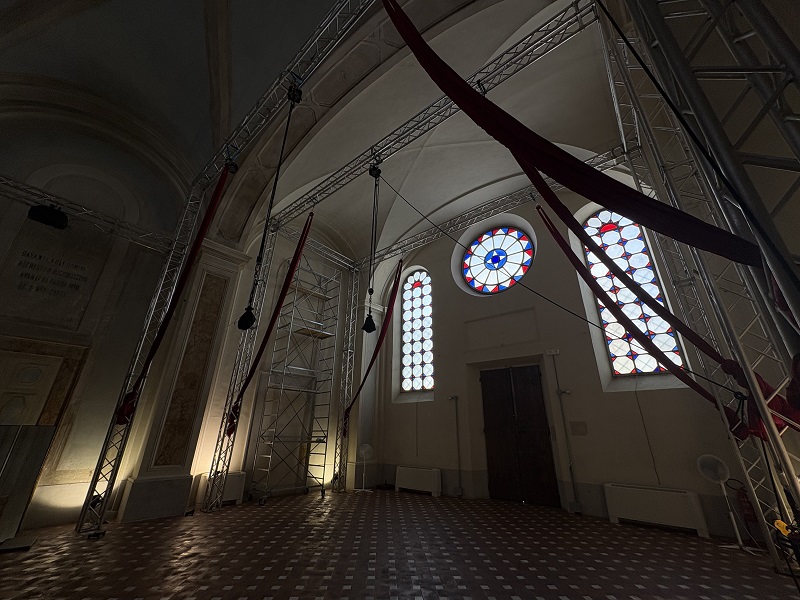 The inside of a church with stained glass windows