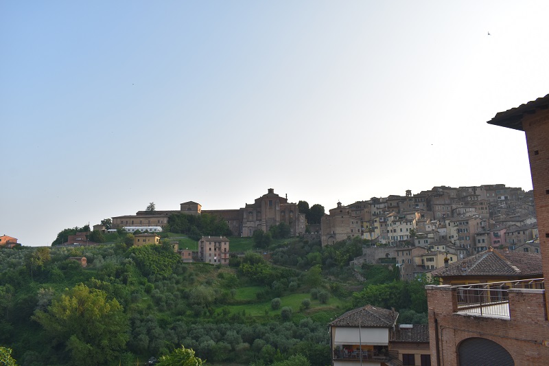 A view of the church of San Domenico centered atop the hill in Siena, Italy