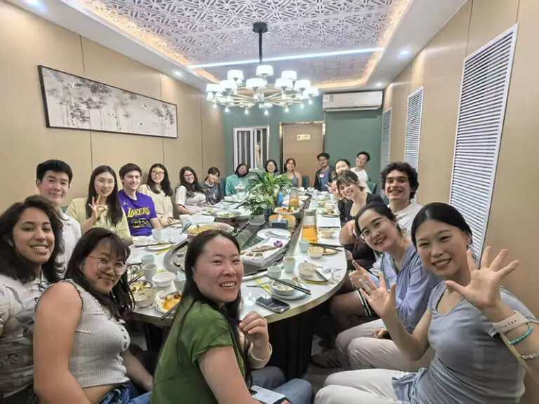 students and teachers at dinner