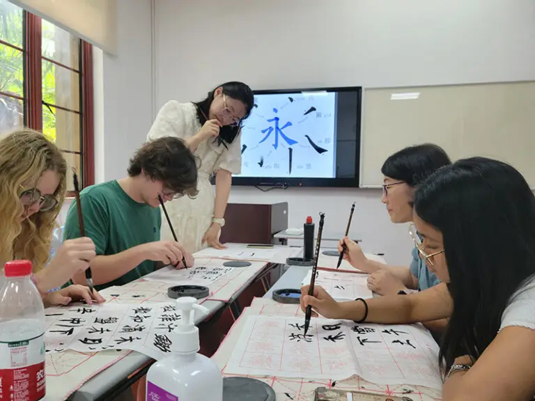students practicing calligraphy